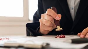 person using wax seal certificate scaled 1