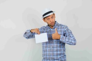 jpeg optimizer young man checked shirt hat holding paper sheet