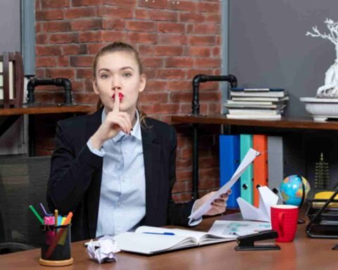jpeg optimizer top view young lady sitting table holding document making silence gesture office